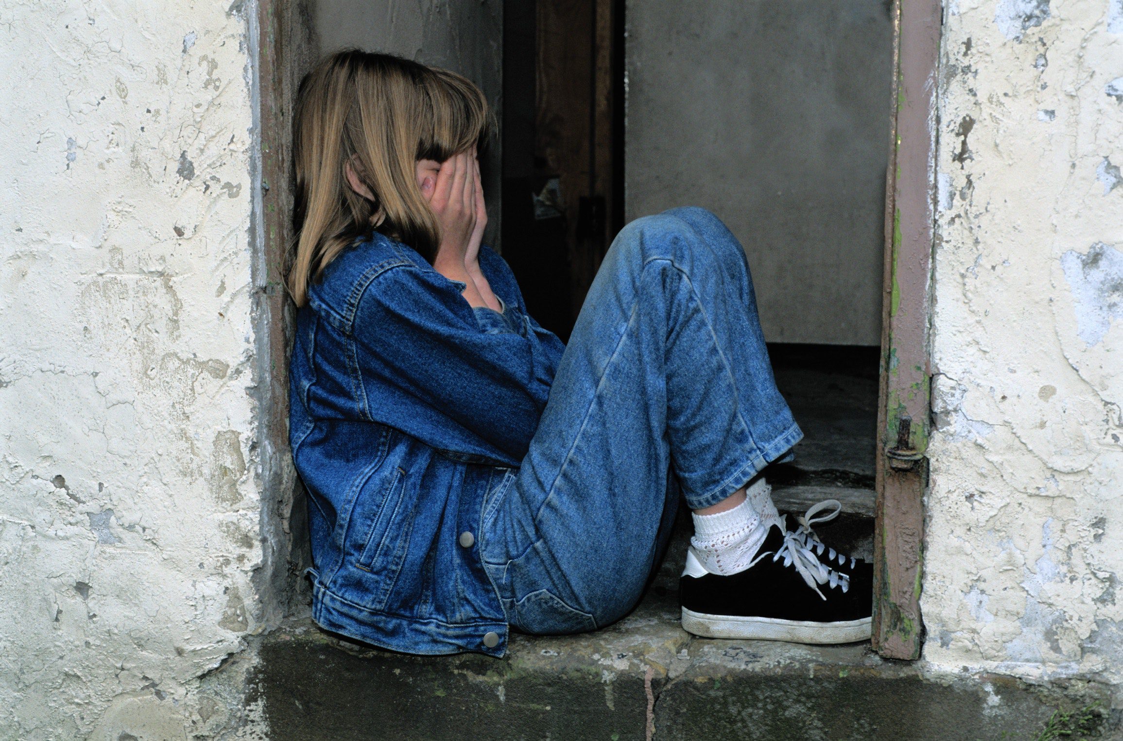girl-jeans-kid-236215 grumpy teenage girl in jeans sitting down with head in her hands