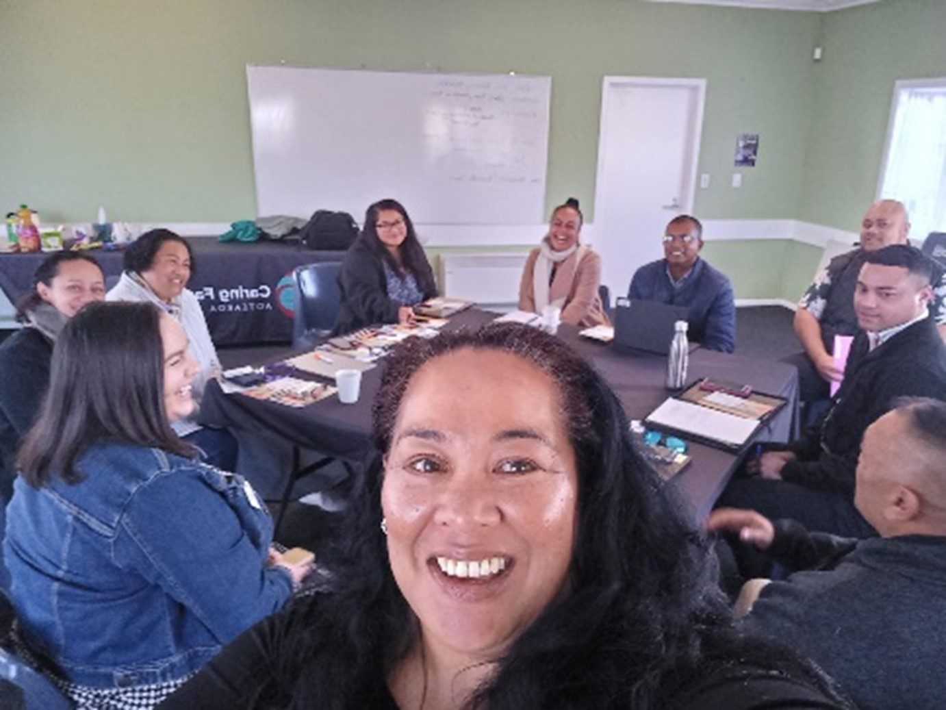 Nu'umoe taking selfie with other polynesian caregivers for September 2023 Caregiver news