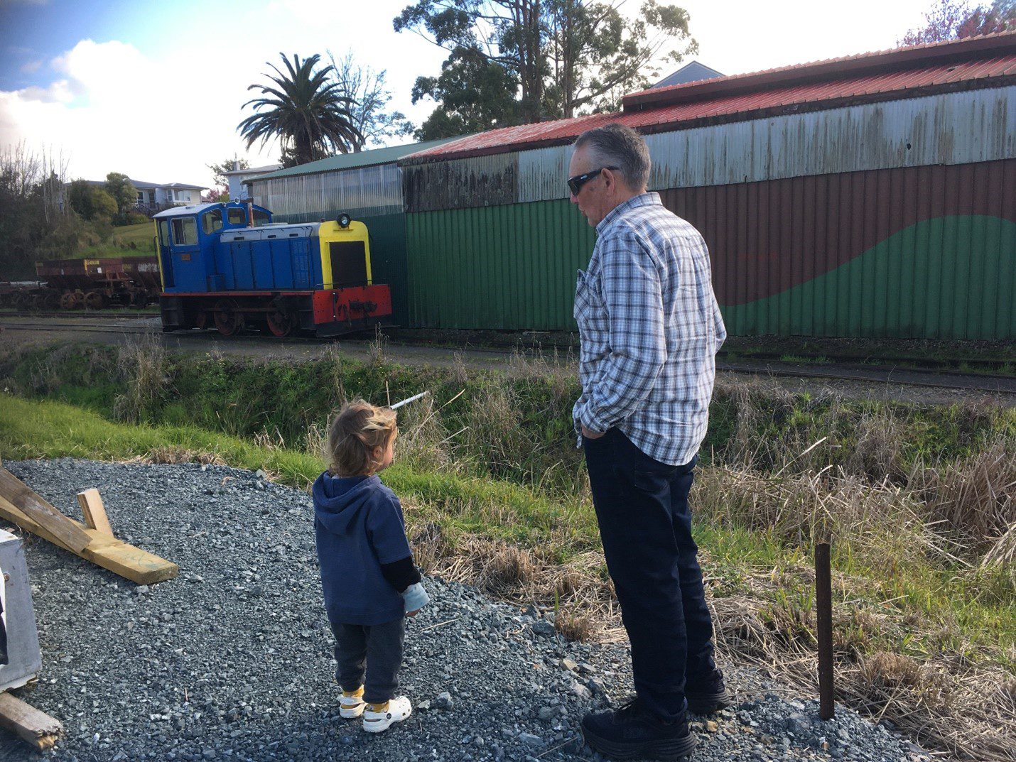 RuruHana's moko grandchild at train station for September Caregiver News